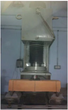 Figure 3. Compressive strength test is being performed on a baked clay cube of 150 mm size, using universal testing machine
