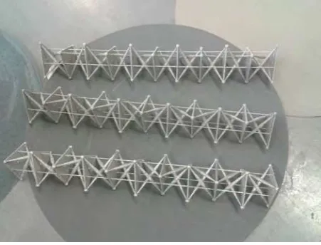 Figure 5: EBM-printed columns with ten building blocks, obtained by alternating left-handed and rigth-handed prisms.