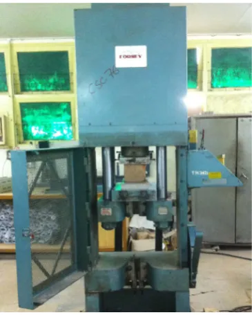 Figure 4. Baked clay cubes of 150 mm size are being tested in Universal Testing Machine