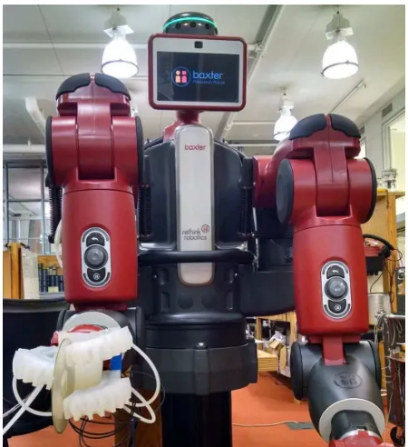 Fig. 1: The soft robotic hand, mounted to the wrist of aBaxter robot, is picking up a sample object.