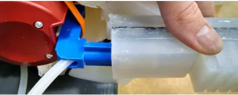 Fig. 2: Attaching a ﬁnger onto the 3D printed interface.