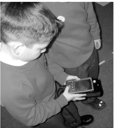 Figure 1. The children using the Snooper tool to find virtual clues.