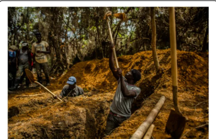 Fig. 2 Suakoko, Bong County, Liberia: workers conducting safe and dignified burials at the Bong County Ebola treatment unit