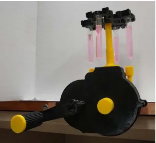 Figure 10.  a) complete system with filled test tubes during rotation and b) a screen capture of a centrifuge cam used for the GUI