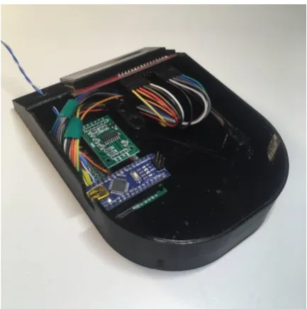Figure 6. The LCD is held in place by two locators behind the slot for the screen. Its wires are tucked under a plastic wire manager attached to the TAL220 boss, then connected to the circuit board