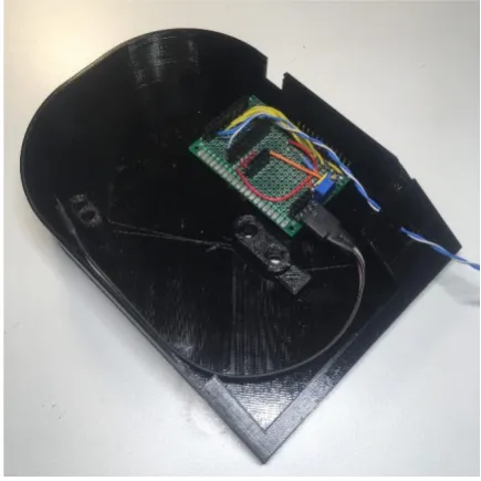 Figure 4. Key features of the base include standoffs to mount the load cell, locators for the screen and circuit board, and a slot for access to the Arduino Nano’s USB port