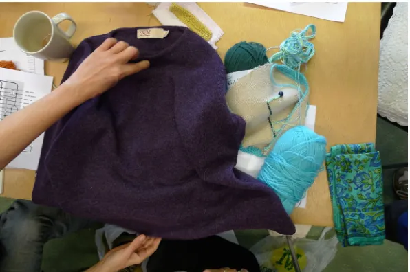 Figure 3. Example 5: participants discussing individual re-knitting projects. Photo: Twigger Holroyd