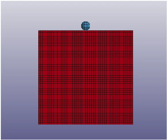 Fig. 1. The initial position of the spherical impactor and the massive metal barrier 