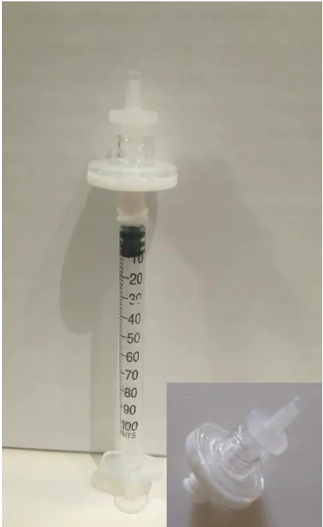 Figure 1 a 22-µm pore filter mounted on a 27-gauge 1 mL tuberculin syringe.Notes: The micropores will prevent the passage of Ta crystals during the preparation of high-dose iVTa from the commercial Ta suspension
