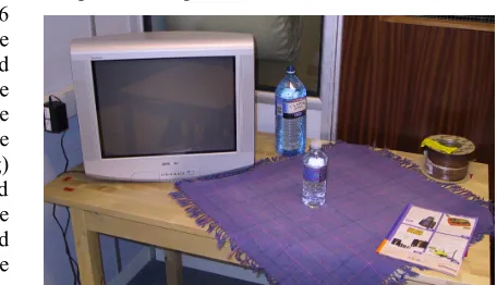 Fig. 2. The experimental setup; objects are stationary on a table while the position of an added object is detected