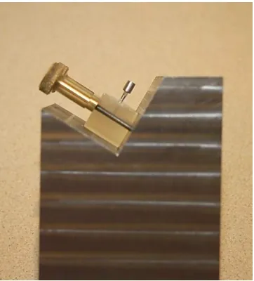 Fig 2: Mounted samples on the steel block were positioned under the vertical ram of the Tensometer (Lloyds Instruments Ltd, Hants, UK)