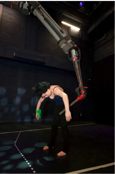 Figure 6: A dance student dances with the robot.