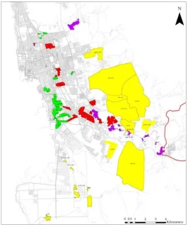 Figure 2. The distribution of informal settlements in Jeddah, from the oldest informal settlement around the city centre (shown in green), through red and purple, to the most recently occupied (yellow) (source: Jeddah Municipality)