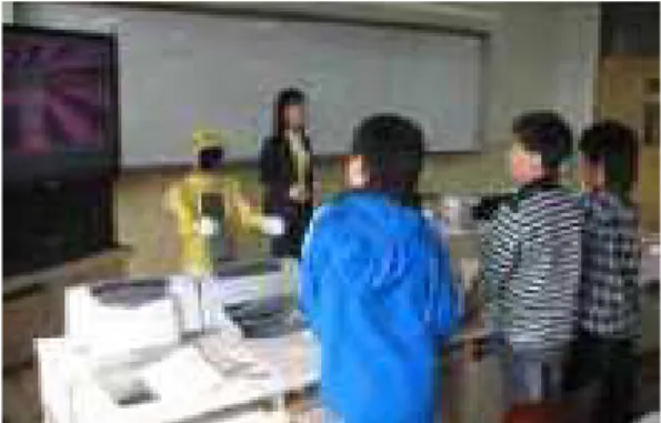 Figure 13. Teacher telling a story with a robot.  2.8. Different Kinds of Educational Service Robots and 