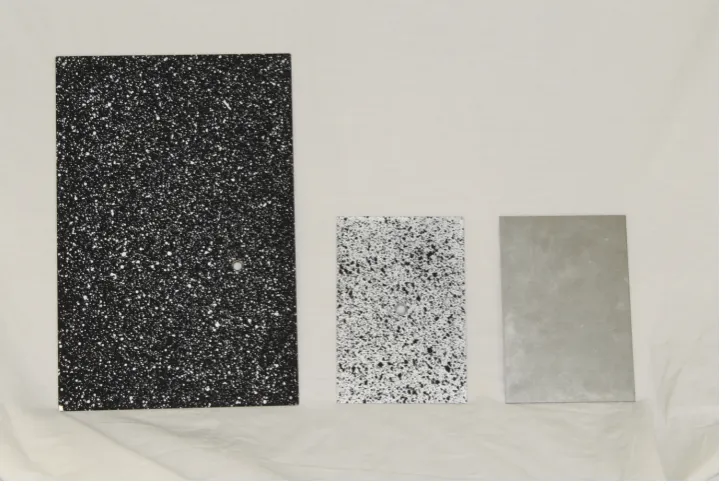 Figure 3.1: One of the large plates sprayed with a base coat of black paint and whitespeckle