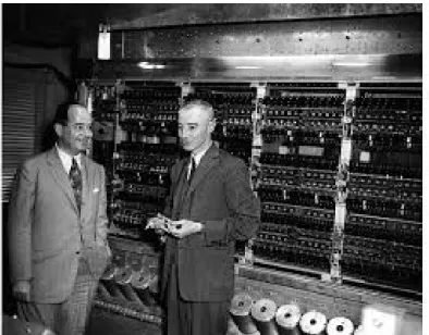 Figure 3. John von Neumann (left) and Robert Oppenheimer (right) in front of the IAS computer The von Neumann architecture concept introduced in 1945 by Eckhart, Mauchly, and von Neumann (Fig