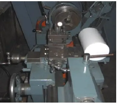 Fig. 4 Teflon rod on the turning machine 
