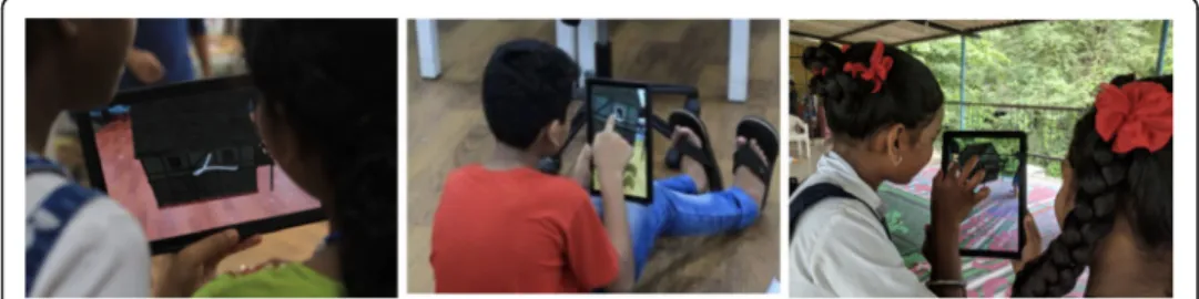 Fig. 4 Students performing the AR learning activities individually and in dyads