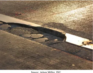 Figure 2.1. Large sections of a plate broken loose on northbound I-380 Exit 19A in Cedar Rapids, Iowa 