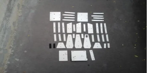 Fig -1: Mica pieces after cutting and drilling 