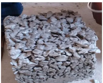 FIGURE 10 PLACING CUBES FOR CURING 