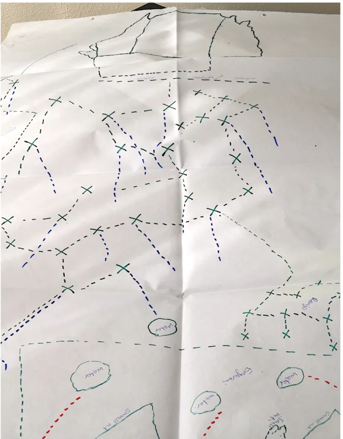Figure 6 –Focus group 4 Oltepesi wazee [Maasai male elders], mapping exercise. X = bomas; blue dashed lines =  livestock  route;  green  dash  between  X  =  connection  between  bomas;  O  =  water;  top  green-dashed  square  =  olopololi  (grazing  for 