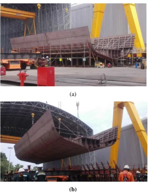 Fig. 1 (a) A completed block awaiting for lifting. (b) The completed block being lifted and ready for transfer to the 