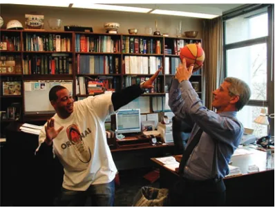 Figure 6Dr. Fauci shooting hoops after hours with James Ashton (left).