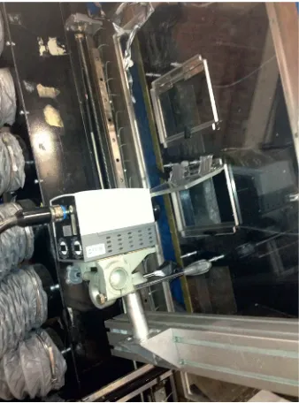 Fig. 5. IR-camera pointing at the instrumented window duringthe experiments.