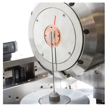 Fig. 1.4: A photo of an object mounted on post in front of a transmissionsource at ANU CTLab, machine name: FEI4.