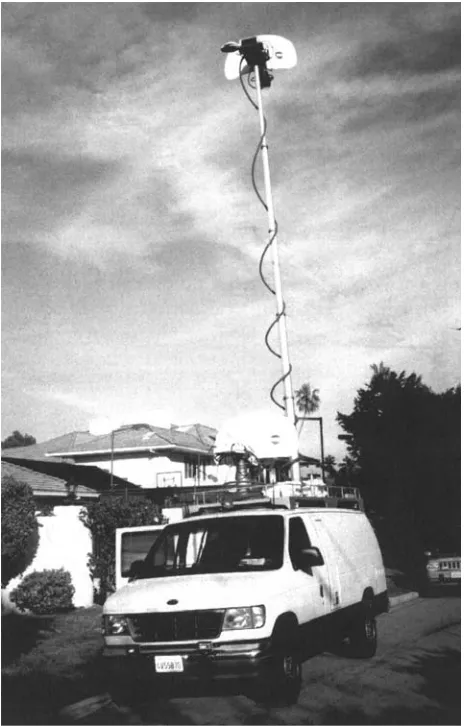 Figure 2-10A microwave truck with its transmitter atop an extended mast for a clear line of sight with the receiver.