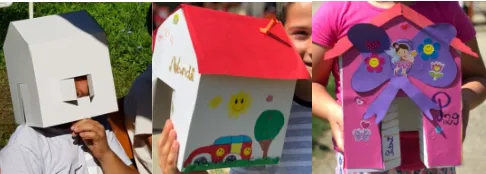 Fig. 3. The first interaction of the children with the cardboard models which they had to decorate and transform in the house of their dreams [13] 