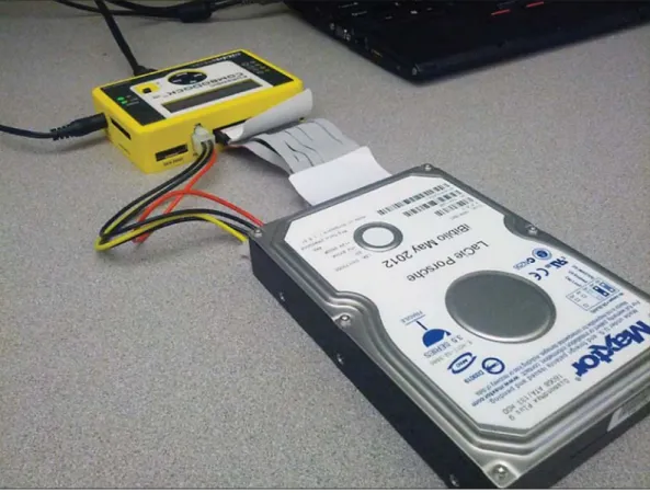Figure 5: A legacy IDE  hard disk connected  to a modern forensic  write blocker.