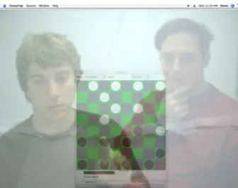 Figure 2-1. The collaborators are playing checkers against the computer using the Facetop video  conferencing system