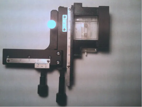 Figure 3.7 Custom built stage to secure the MCA device to the tilting microscope. 