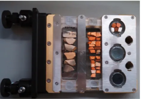 Figure 4.8. Laser ablation  sample cartridge. Two slide  holders hold ceramic samples,  and three circular mounts hold  reference standards