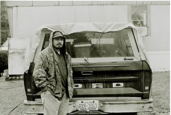 Figure 3: Ruben Olmos with his father’s blue Ford truck, Semora, N.C. 