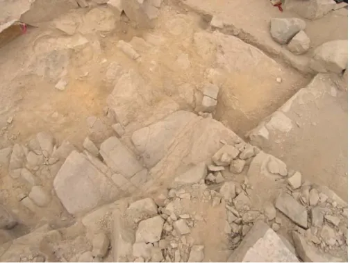 Figure 5.2.2. The rock outcrop hearth, Feature 58.01, in the Feature 58 kitchen, Compound 6