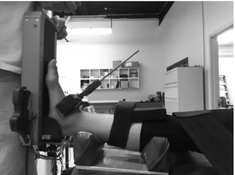 Figure 3.6: Medial view of Hollis ankle arthrometer set up with straps securing knee and ankle