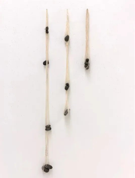 Figure 14 Stochastic still Yarn, river stones Longest 48 in.