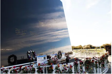 Figure 4.2 The Space Mirror Memorial at Kennedy Space Center and flowers from NASA’s annual Day of Remembrance