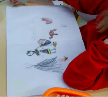 Figure 3. Student creating a drawing of her Sami life ways. Photo: Laurie Eldridge