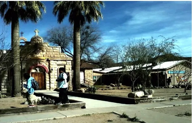 Fig. 1 St. Charles Catholic Church is on the left and gray Mission 