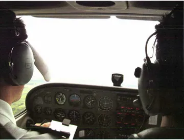 Figure 18. Student Wearing IFR Hood While Flying on Instruments. 