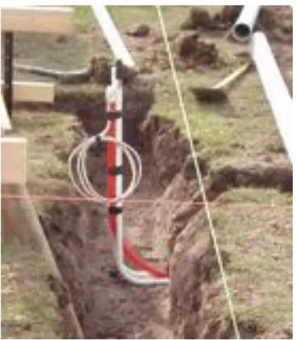 Figure A3.22 - Installation of conduits with draw-wires for electrical and data services to the enclosed-perimeter platform-floored test cell  (June 13, 2006) 