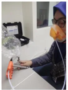 Fig. 2 - One of the panellist is sniffing the samples 