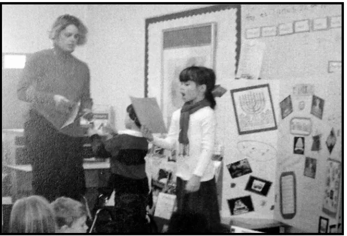 Figure 5.3. Sol, Kat and Mrs. Muller teach the class about Hanukkah 