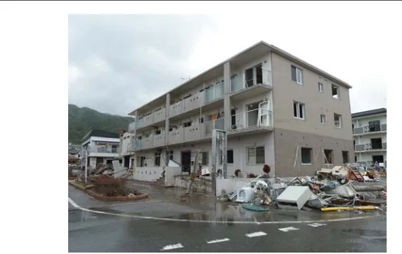 Fig. 7 Apartment building of RC shear wall construction in Ofunato City. Seaward side of the building is¯shown