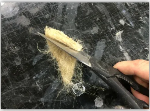 Figure 9: Cutting a small bundle of kenaf into 5 - 10 mm lengths with scissors 