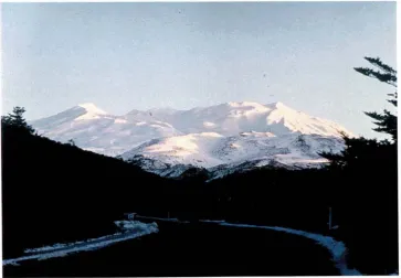 Fig 3 Tongariro National Park in winter, showing mountains. Ngaurahoe (2291 m) is the conical mountain in centre, Tongariro (1967) the smaller, older mountain to the right (photo G.Rapson)
